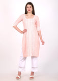 Model wearing light pink embroidered cotton kurta with lace detailing and white trousers, front view