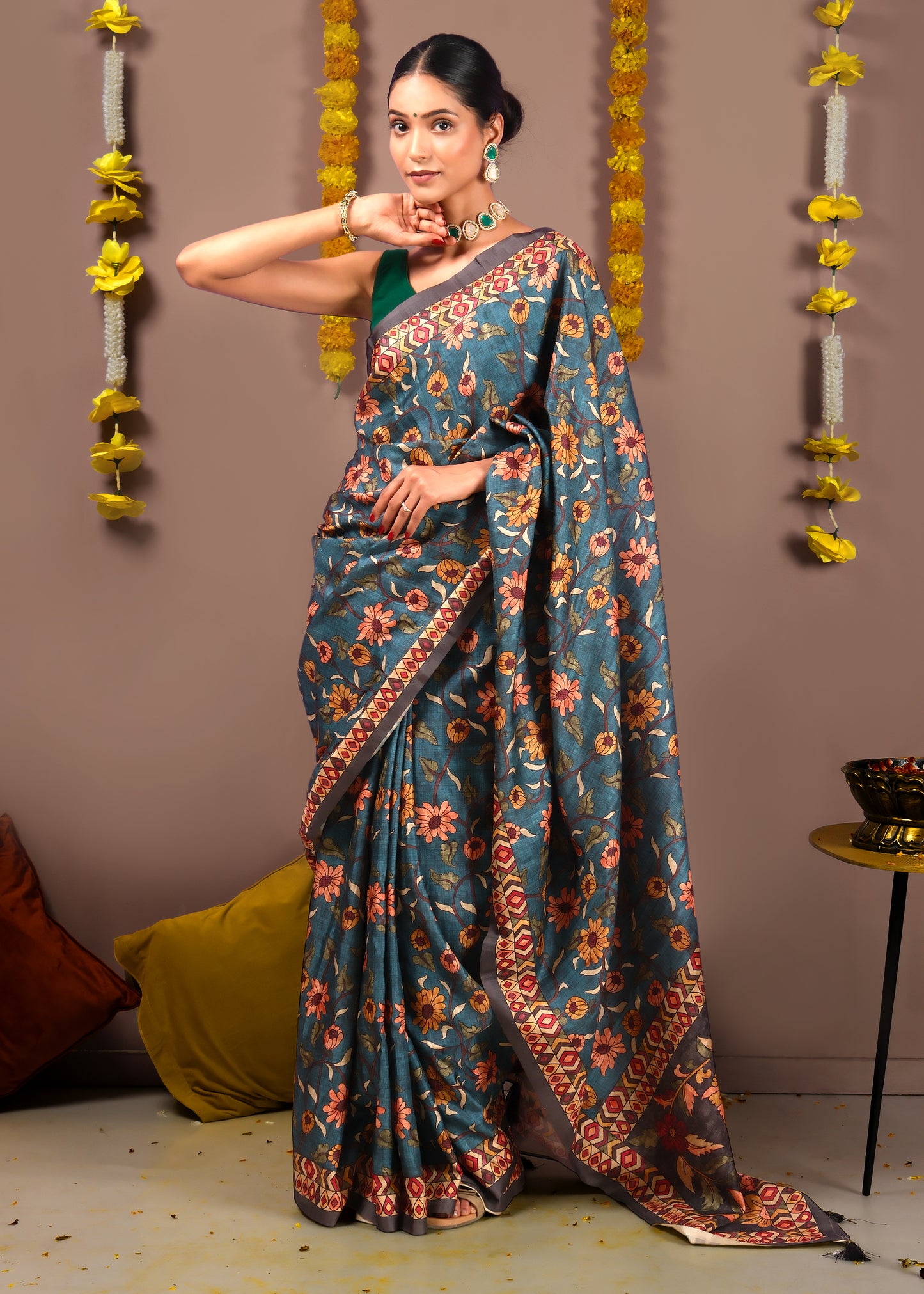 Elegant blue silk saree with traditional floral pattern and detailed border