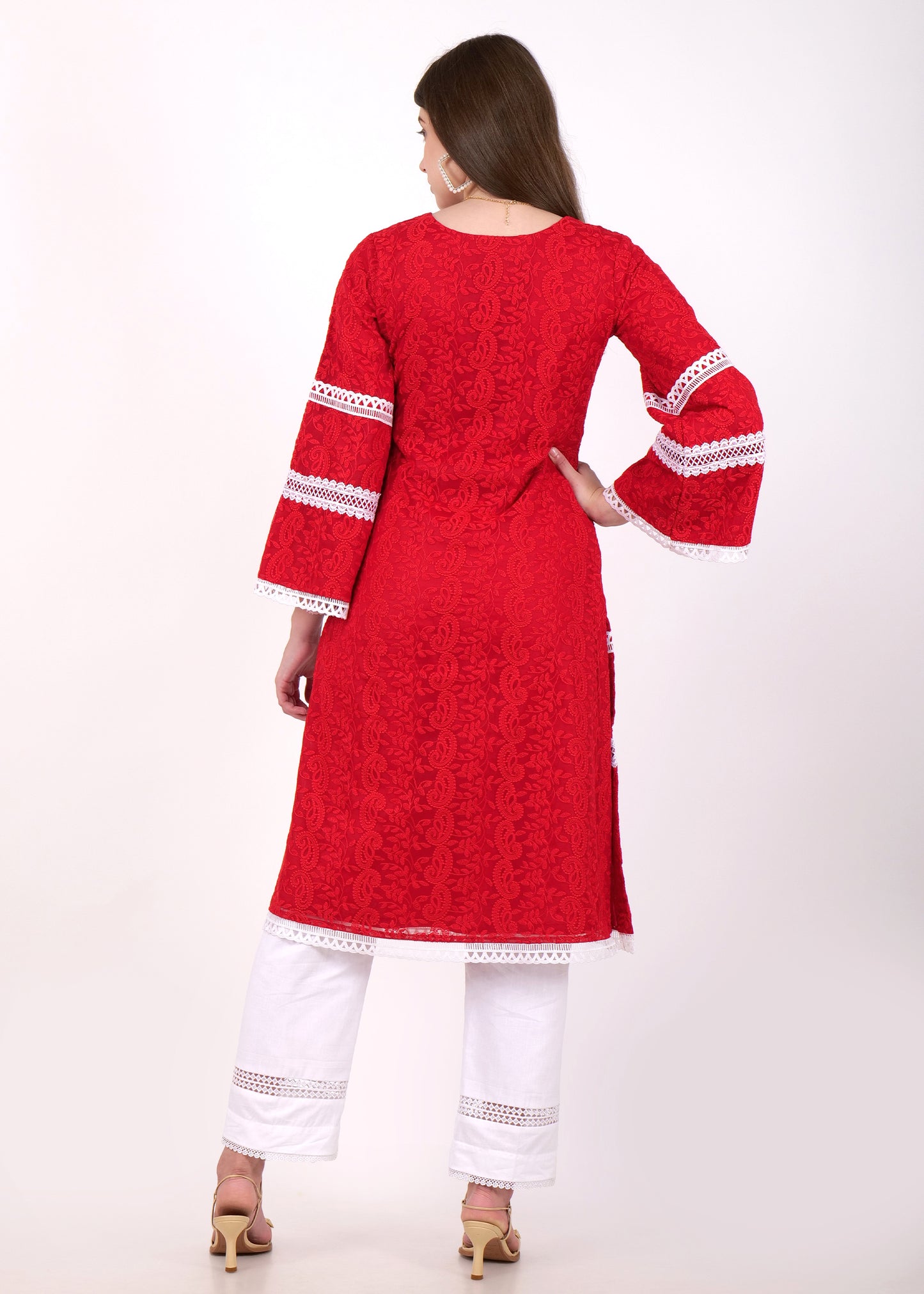 The back view of the red lace kurta, showcasing detailed lacework and a comfortable, relaxed fit