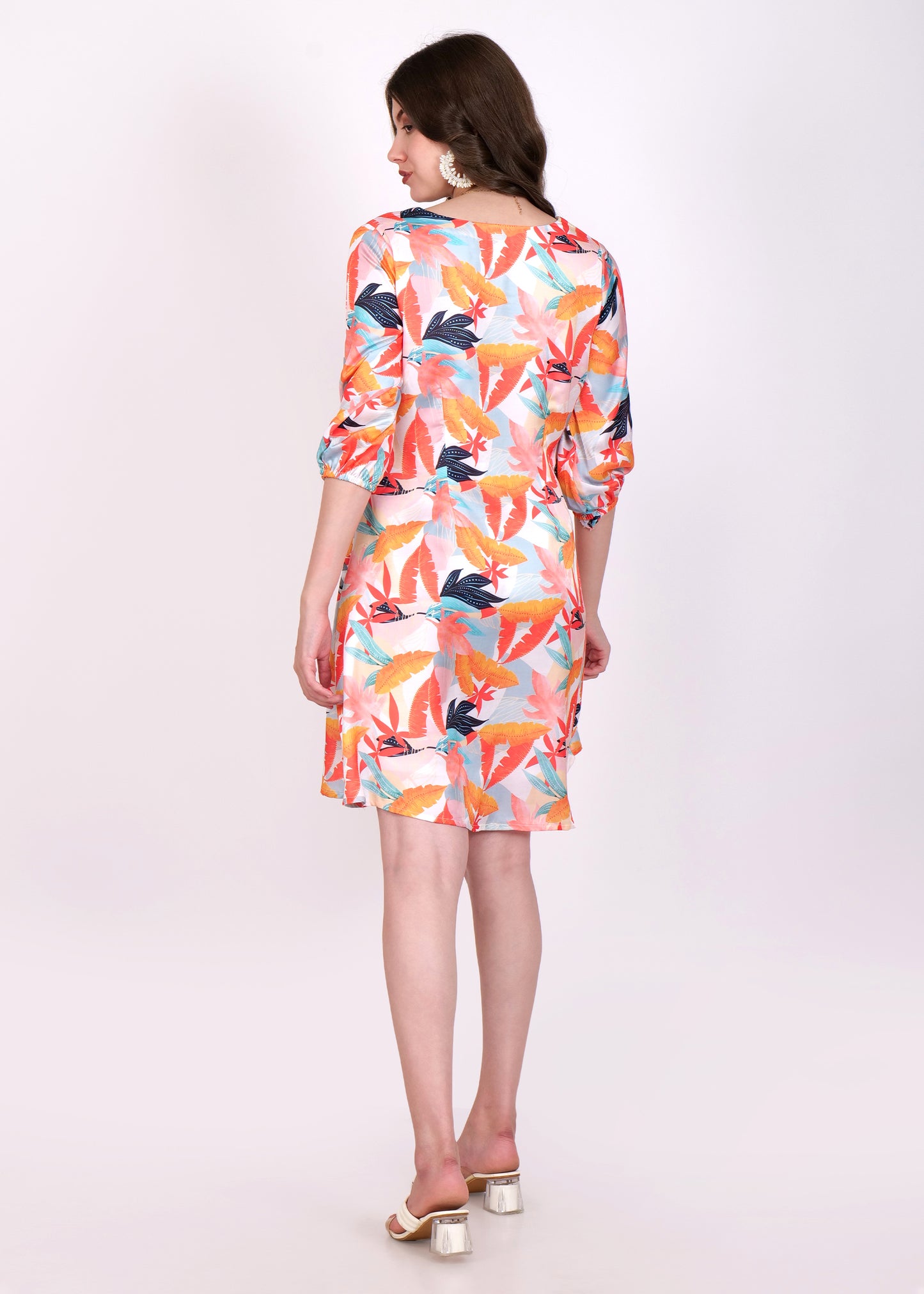 A back view of the floral dress, highlighting the seamless, comfortable fit with the tropical floral print extending across the back.
