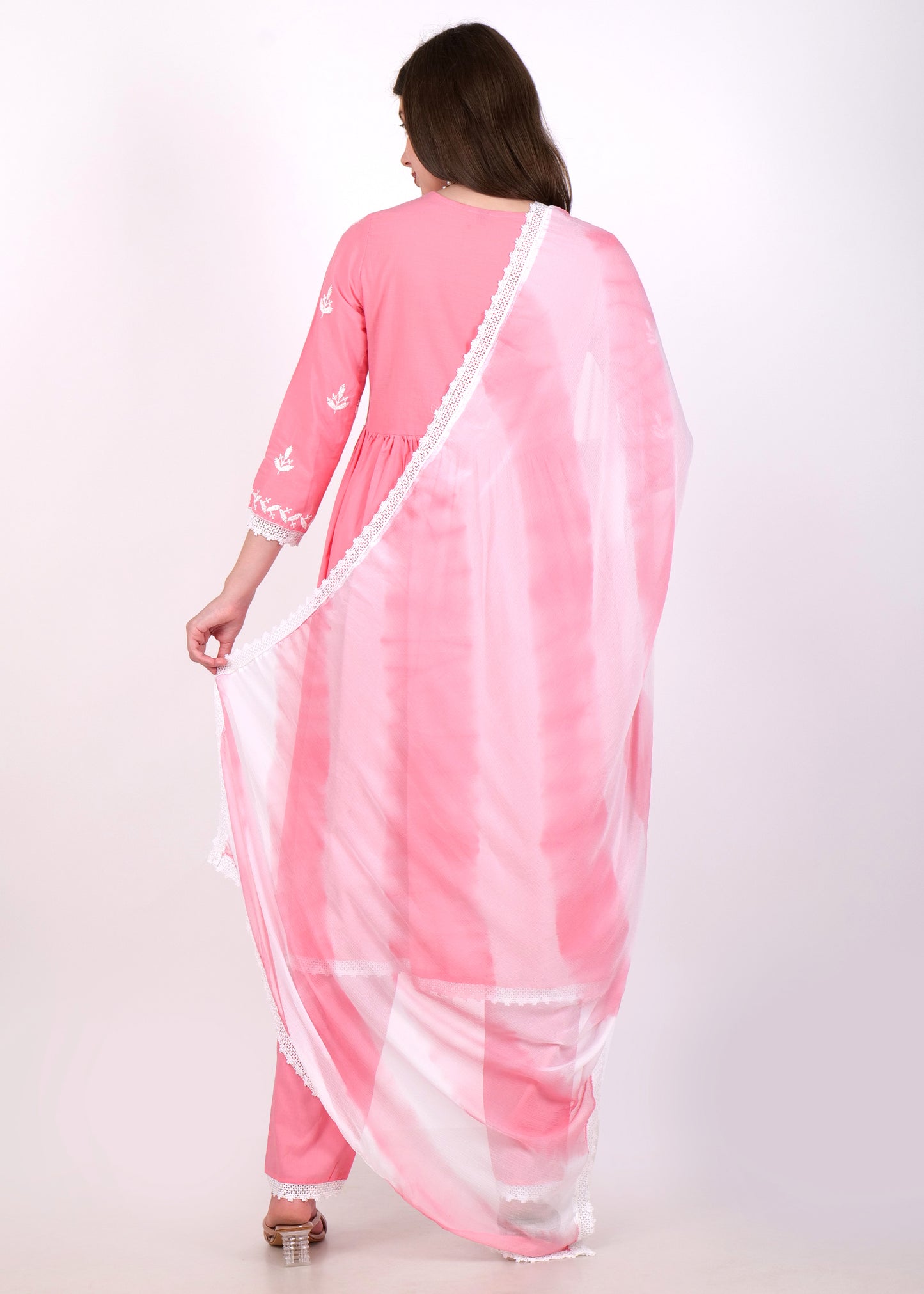 Back view of a woman showcasing a sheer white dupatta with pink tie-dye design, paired with a pink embroidered Anarkali set.