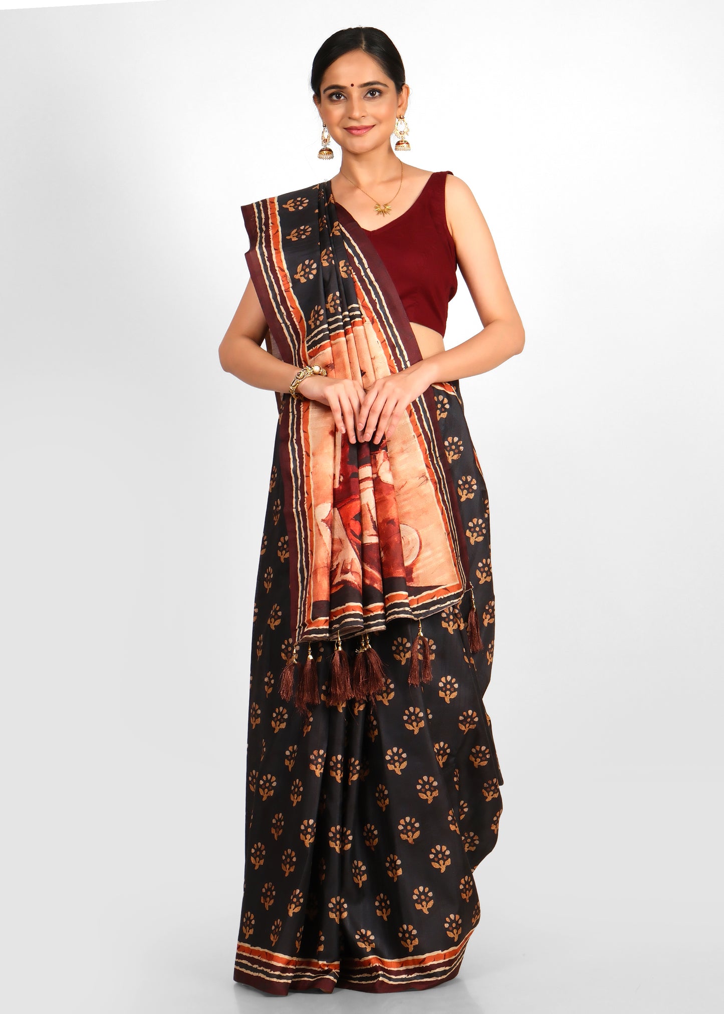 Close-up of the saree's artistic pallu design and floral motifs, highlighting the fine craftsmanship of the black saree