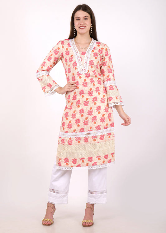 Woman in a beige and pink floral printed kurta with white lace details, paired with white pants