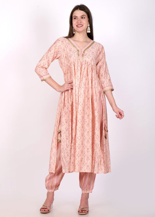 "Peach printed Anarkali with intricate gold border detailing, paired with striped salwar, perfect for ethnic wear."