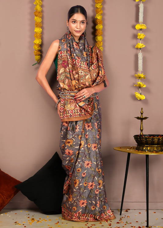 Elegant model showcasing a floral printed saree with detailed embroidery work and a matching blouse