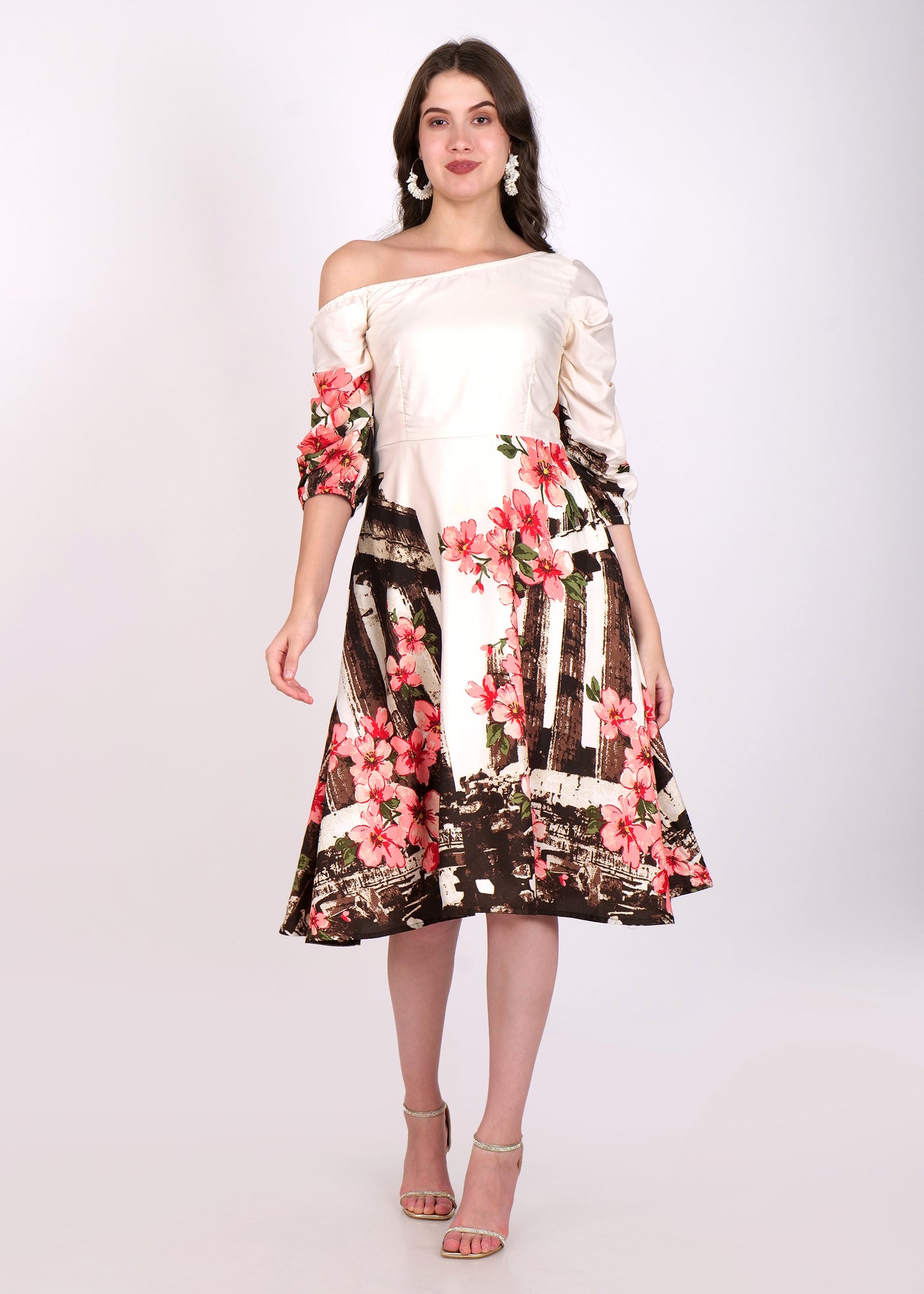 Floral off-shoulder satin dress with 3/4 sleeves and A-line silhouette, featuring vibrant pink floral print and a beige base, styled with statement earrings and high heels