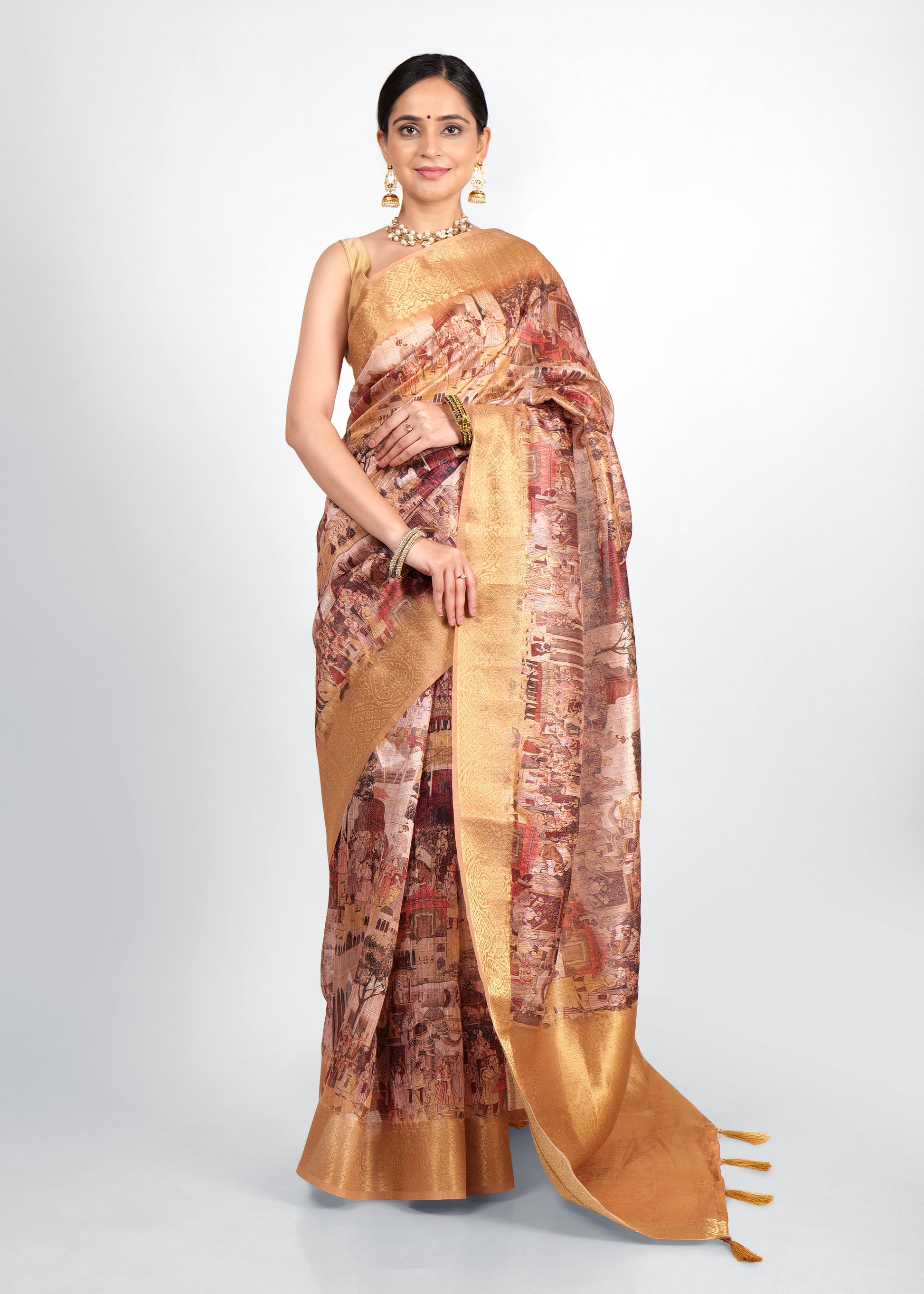 A model gracefully draped in a golden Banarasi saree featuring intricate Krishna Rasleela motifs, adorned with traditional jewelry, standing in an elegant pose