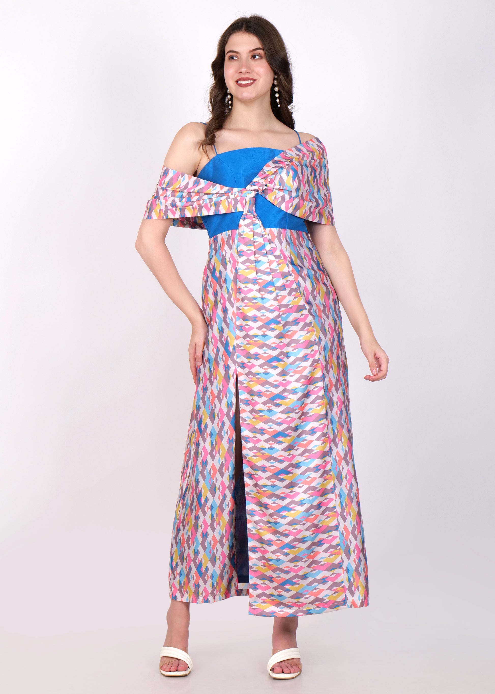 Model wearing a colorful geometric print off-shoulder maxi dress with a blue bustier and a front slit