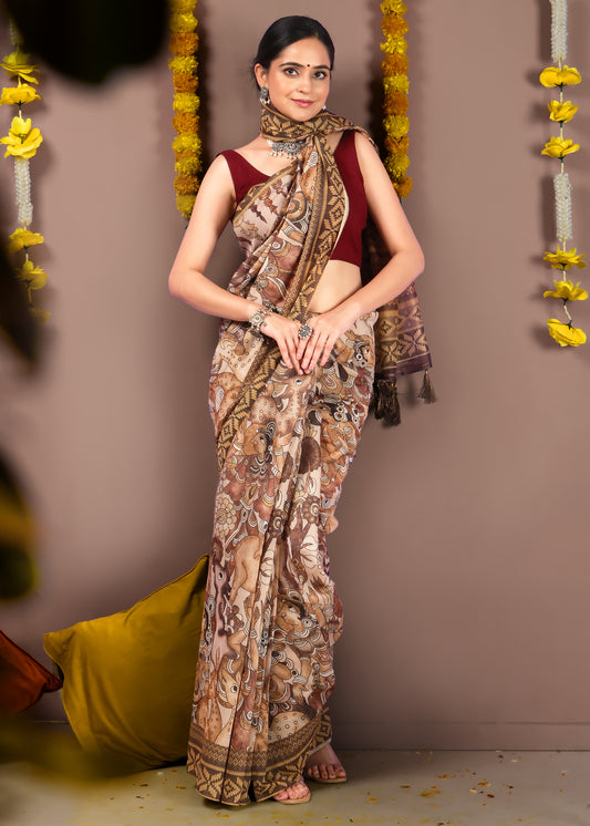 Model wearing an artistic hand-painted saree with intricate folk patterns, paired with a maroon blouse, in front of a festive decor