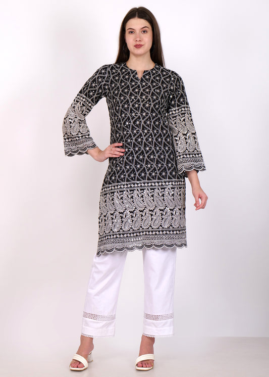 Black embroidered kurta with white intricate design and three-quarter bell sleeves, paired with white trousers for an elegant look