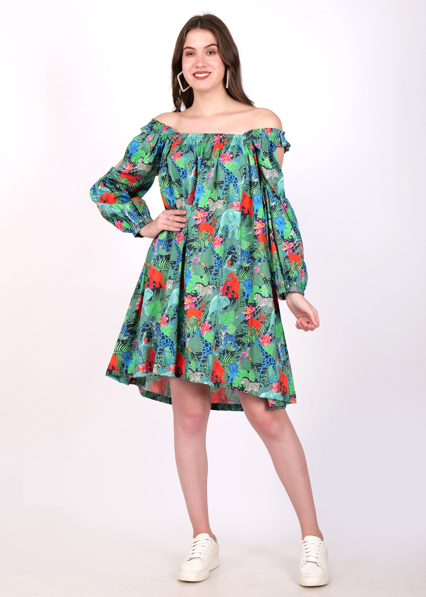 Woman wearing an off-shoulder A-line dress with vibrant jungle print, standing in a confident pose.