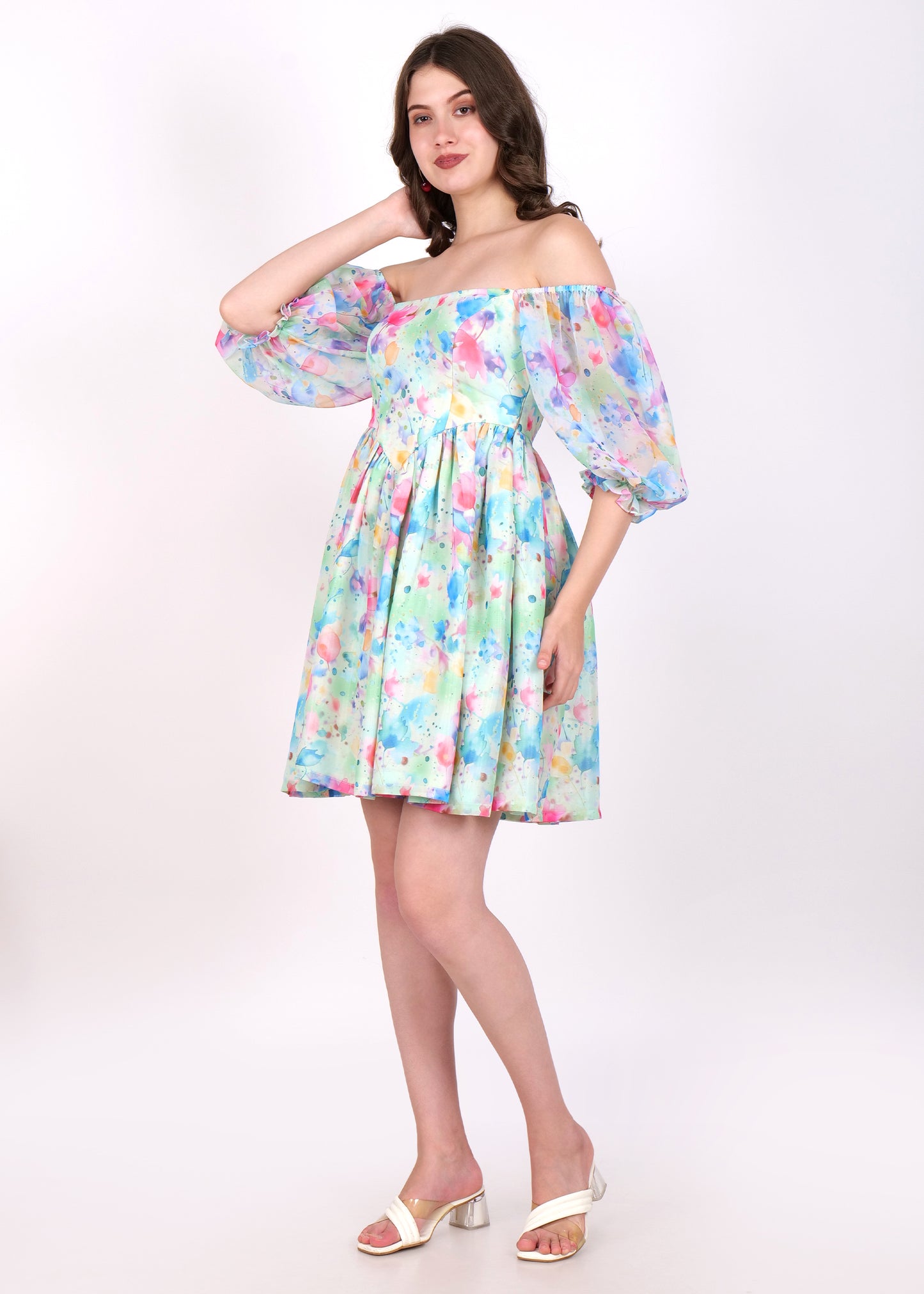 Side view of a pastel floral off-shoulder dress with soft watercolor print