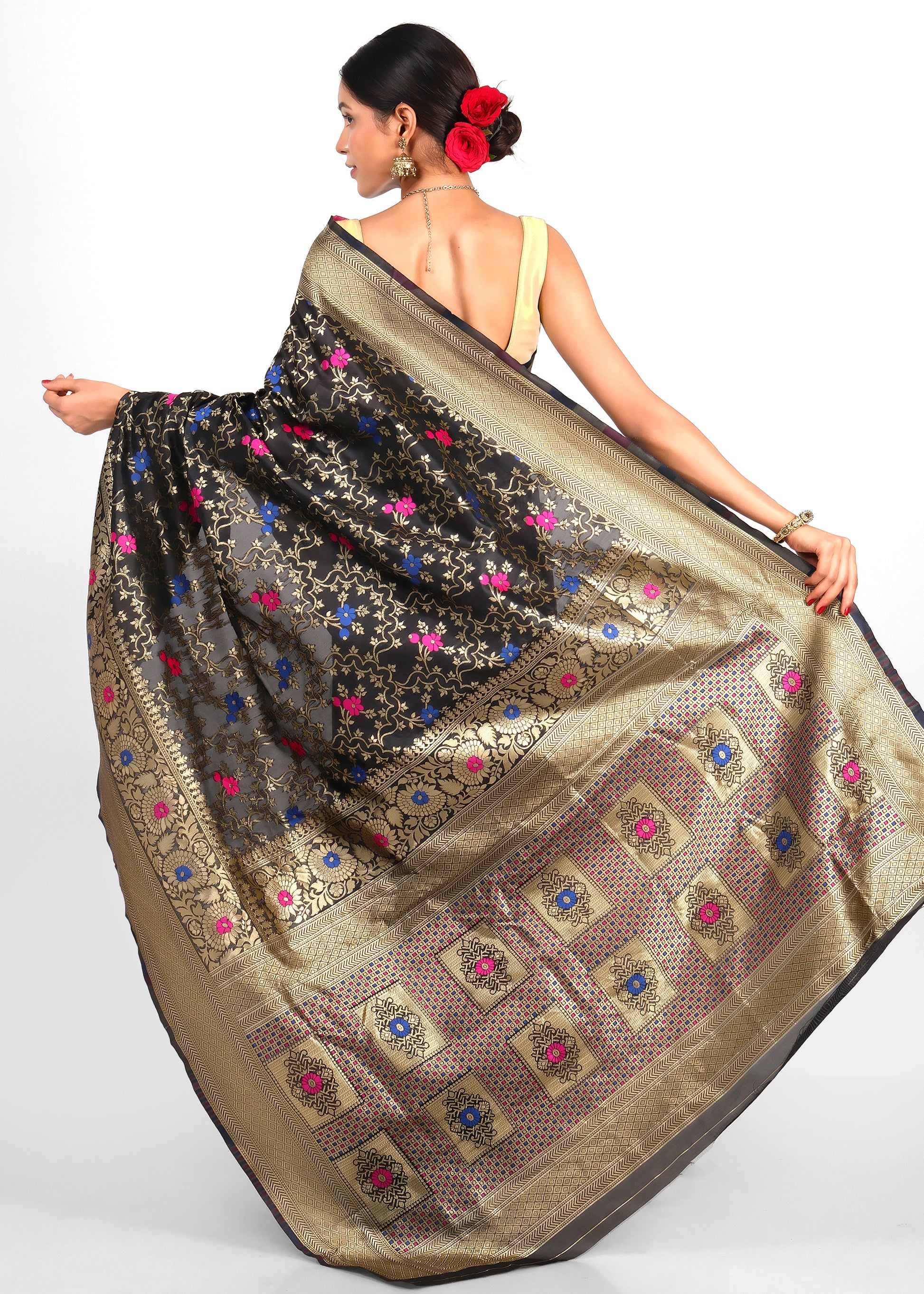 Back view of a black Banarasi silk saree with golden pallu featuring elaborate floral and geometric designs