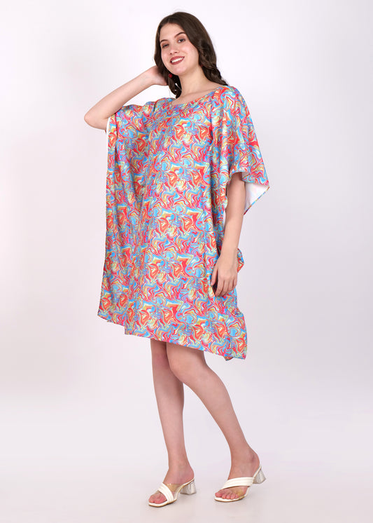 Side view of a model in a vibrant kaftan dress featuring a multicolor swirl pattern, showcasing the flowy design