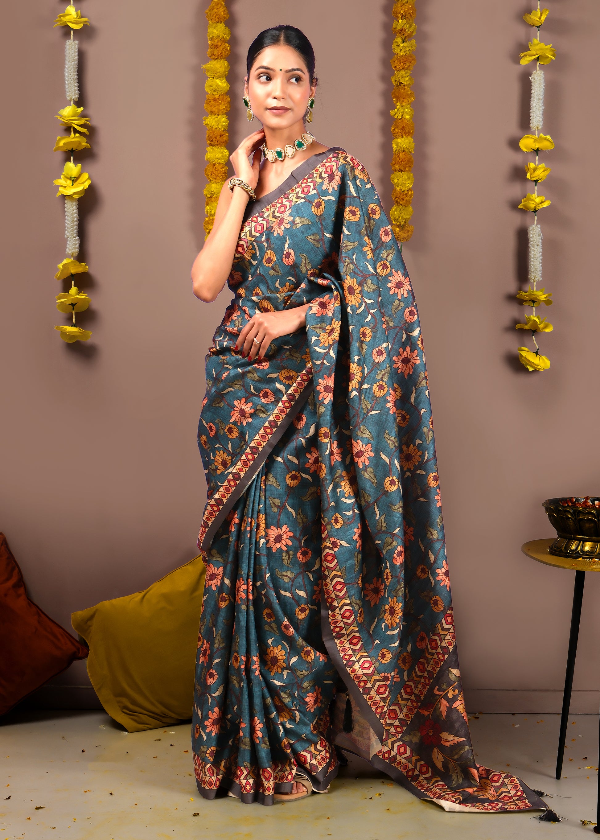 Elegant blue silk saree with traditional floral pattern and detailed border