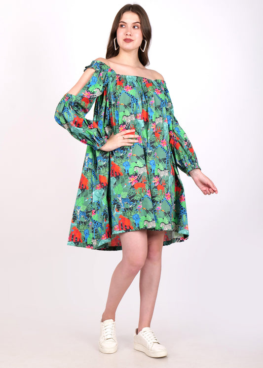 Full view of a woman in a jungle-themed off-shoulder dress, looking to the side and striking a poised pose