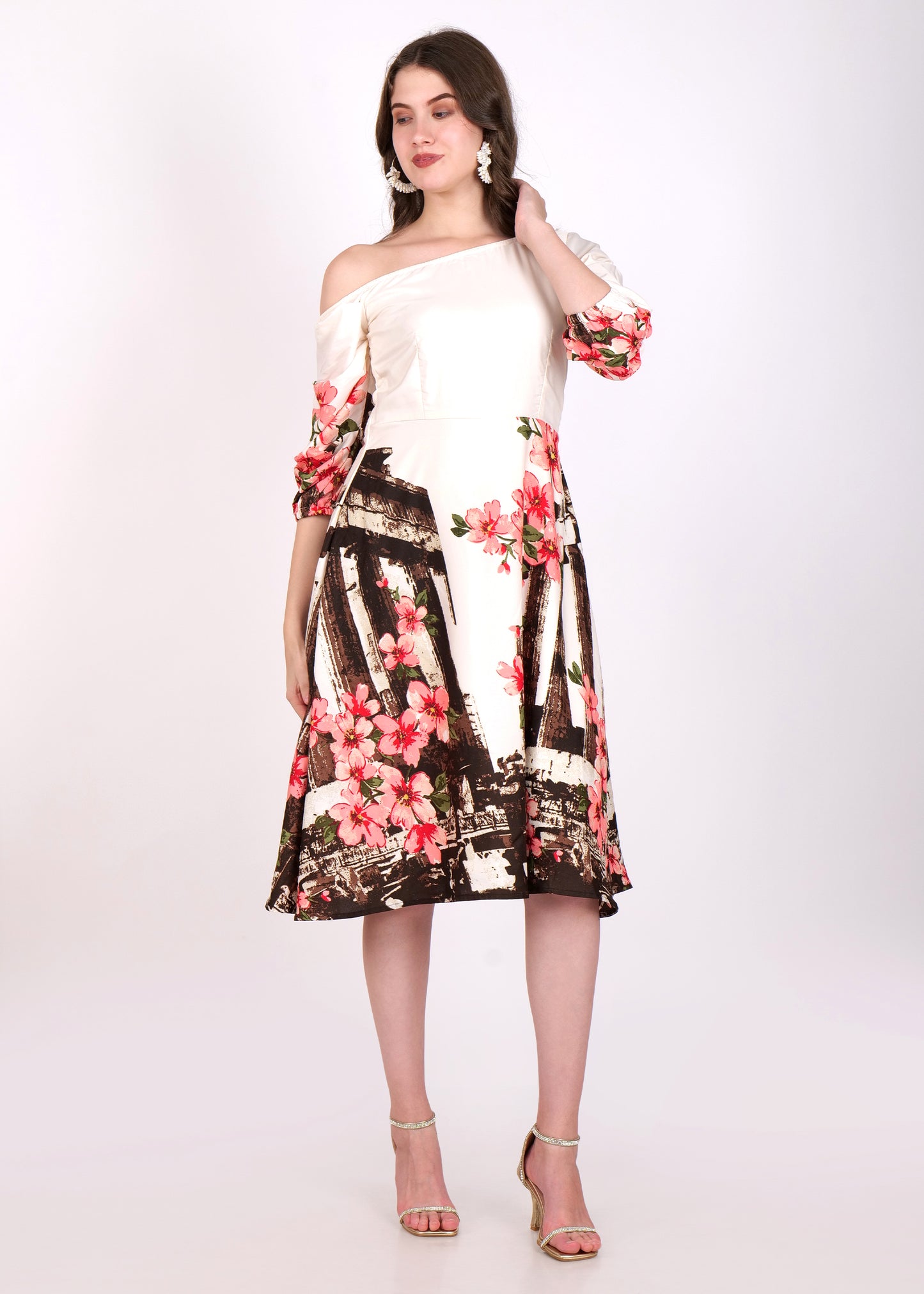 Elegant off-shoulder dress in beige satin, adorned with bold pink floral print, paired with statement earrings, styled with a twirl-ready A-line skirt