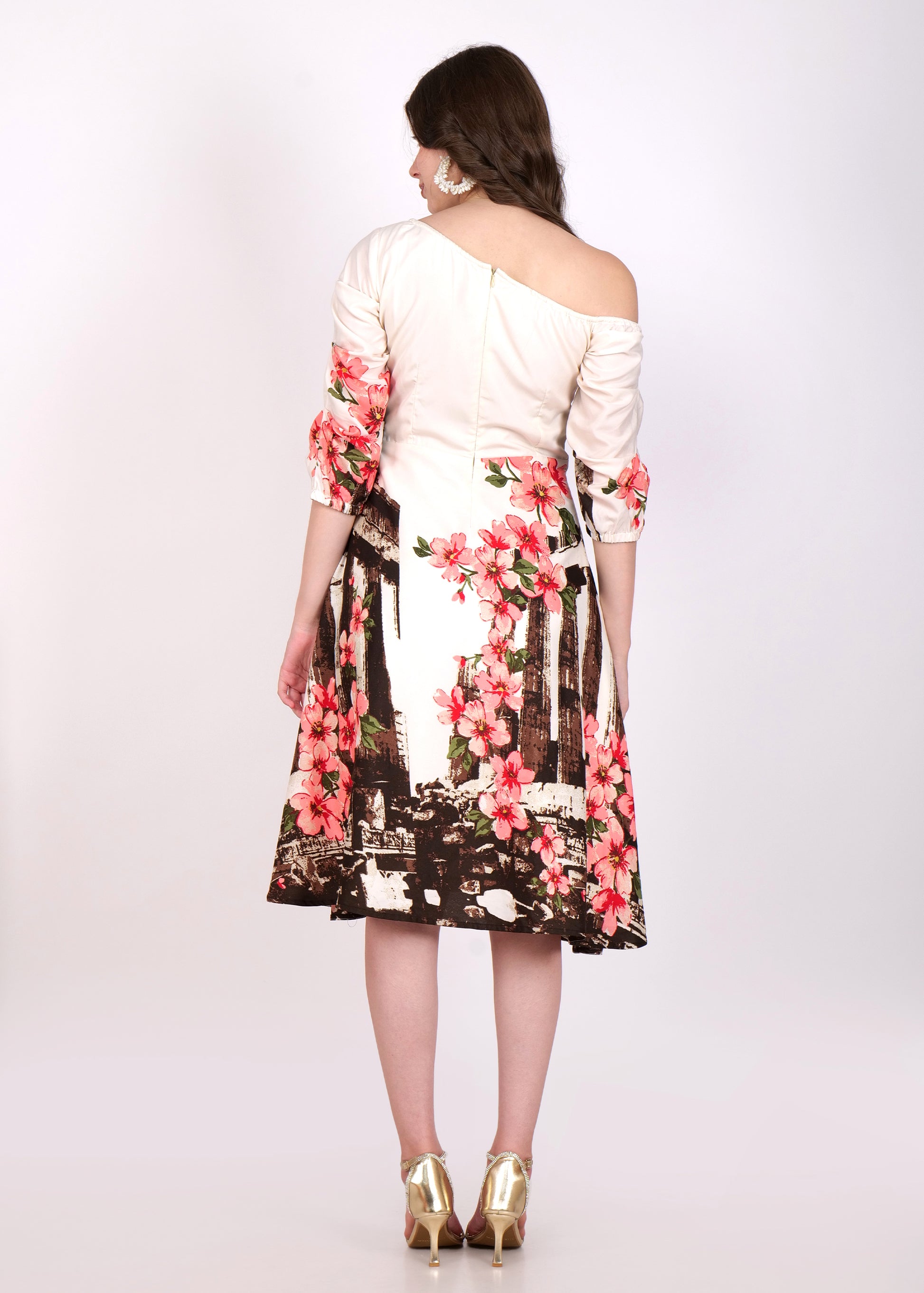 Back view of a floral off-shoulder satin A-line dress, featuring a fitted bodice and flowing skirt, with a concealed zip and vibrant flower print