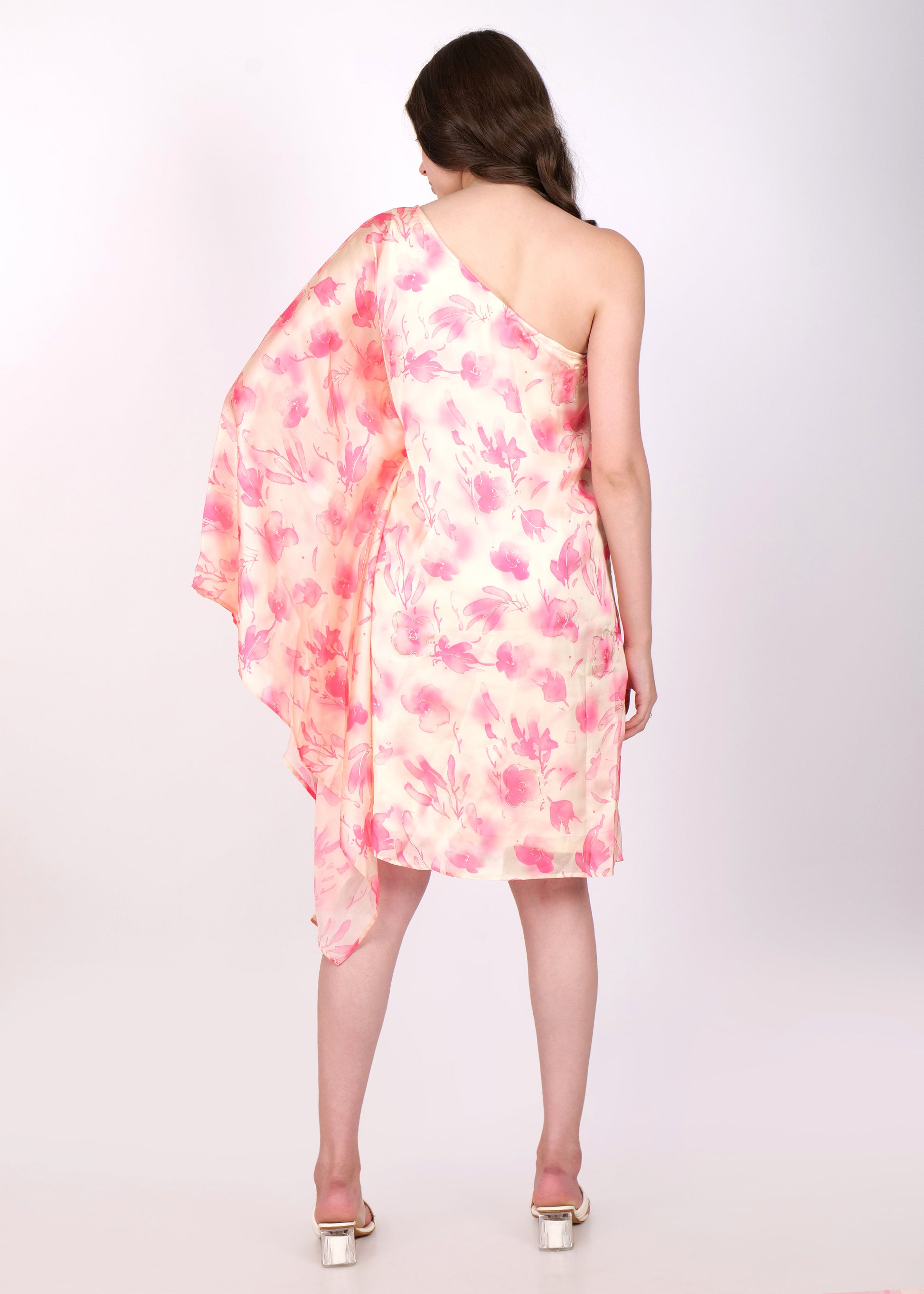 Back view of a one-shoulder pastel floral dress with delicate pink watercolor flower 