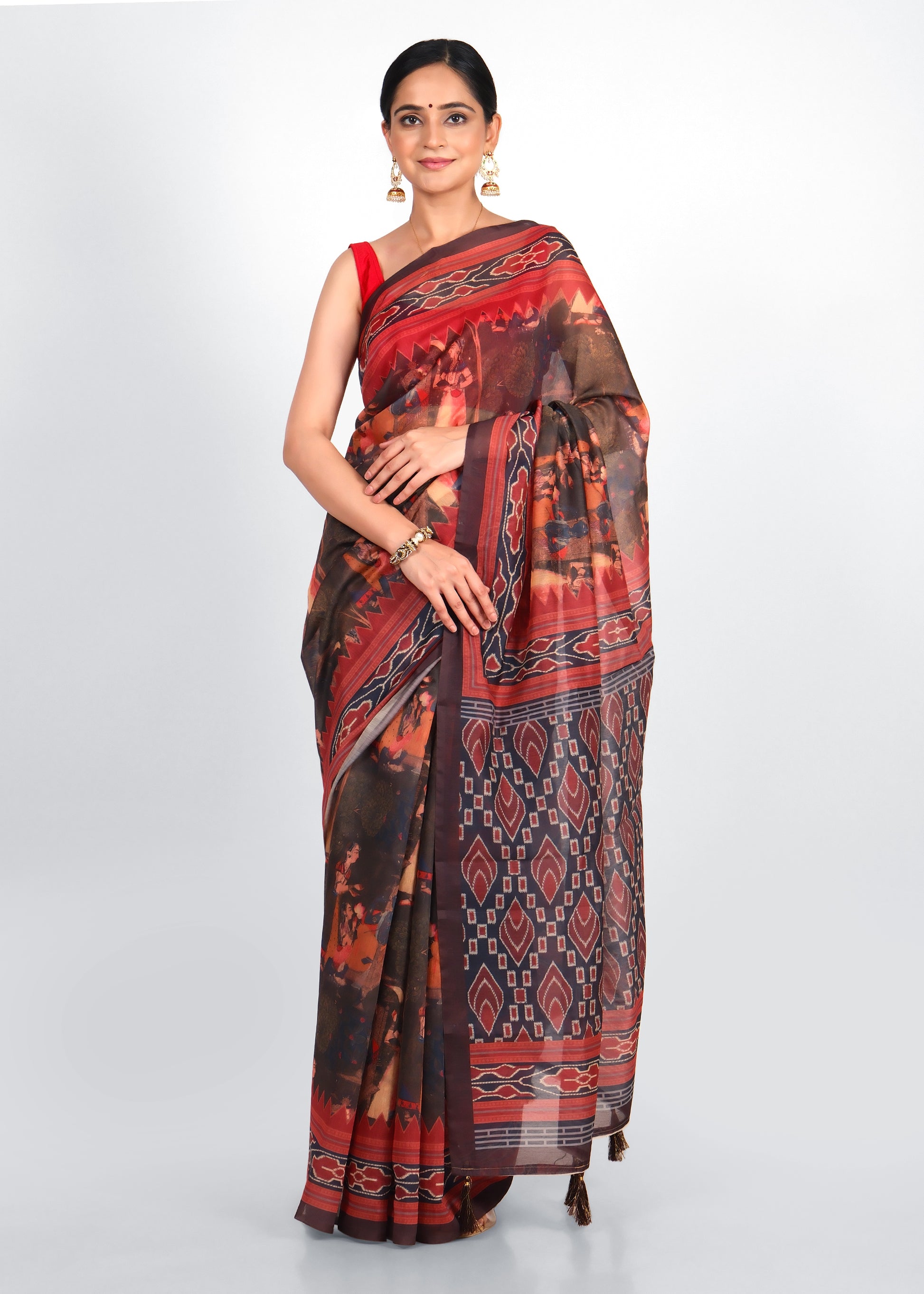 Full-length front view of a woman wearing a vibrant handwoven Ikat saree, perfect for cultural occasions.