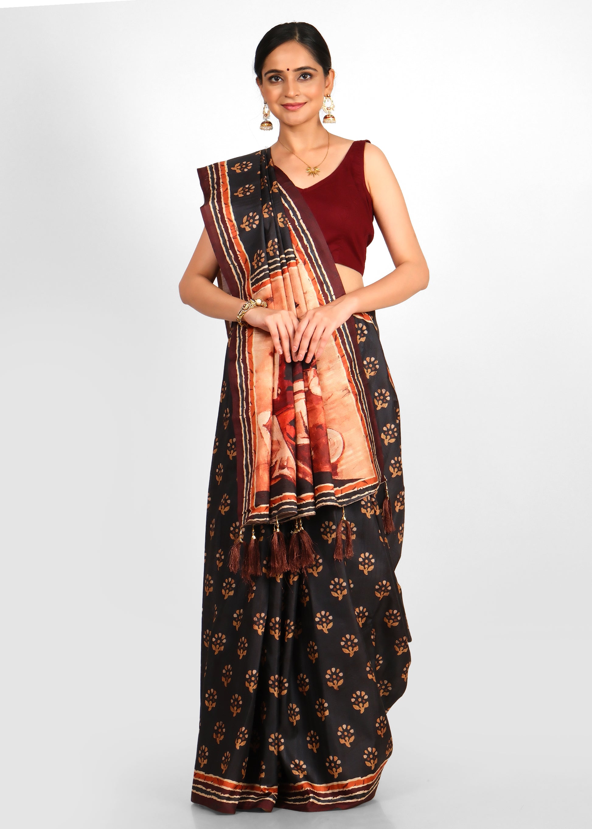 Close-up of the saree's artistic pallu design and floral motifs, highlighting the fine craftsmanship of the black saree