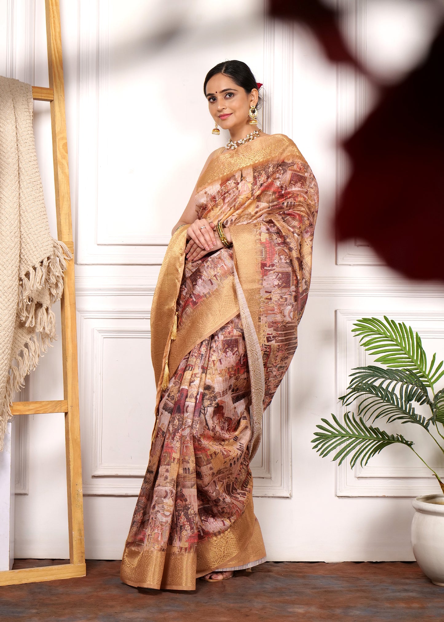 Side view of a model posing gracefully in a Krishna Rasleela Banarasi saree, highlighting the rich texture and traditional motifs