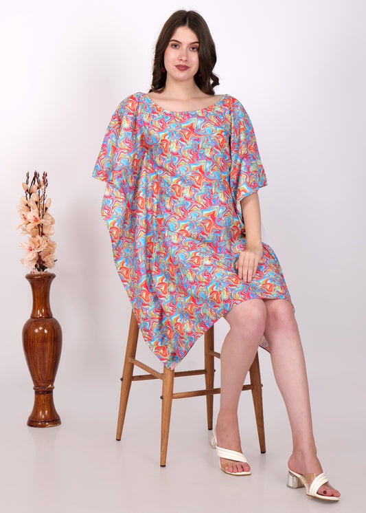 Model sitting gracefully in a multicolor kaftan dress, paired with white sandals, styled for a chic summer look