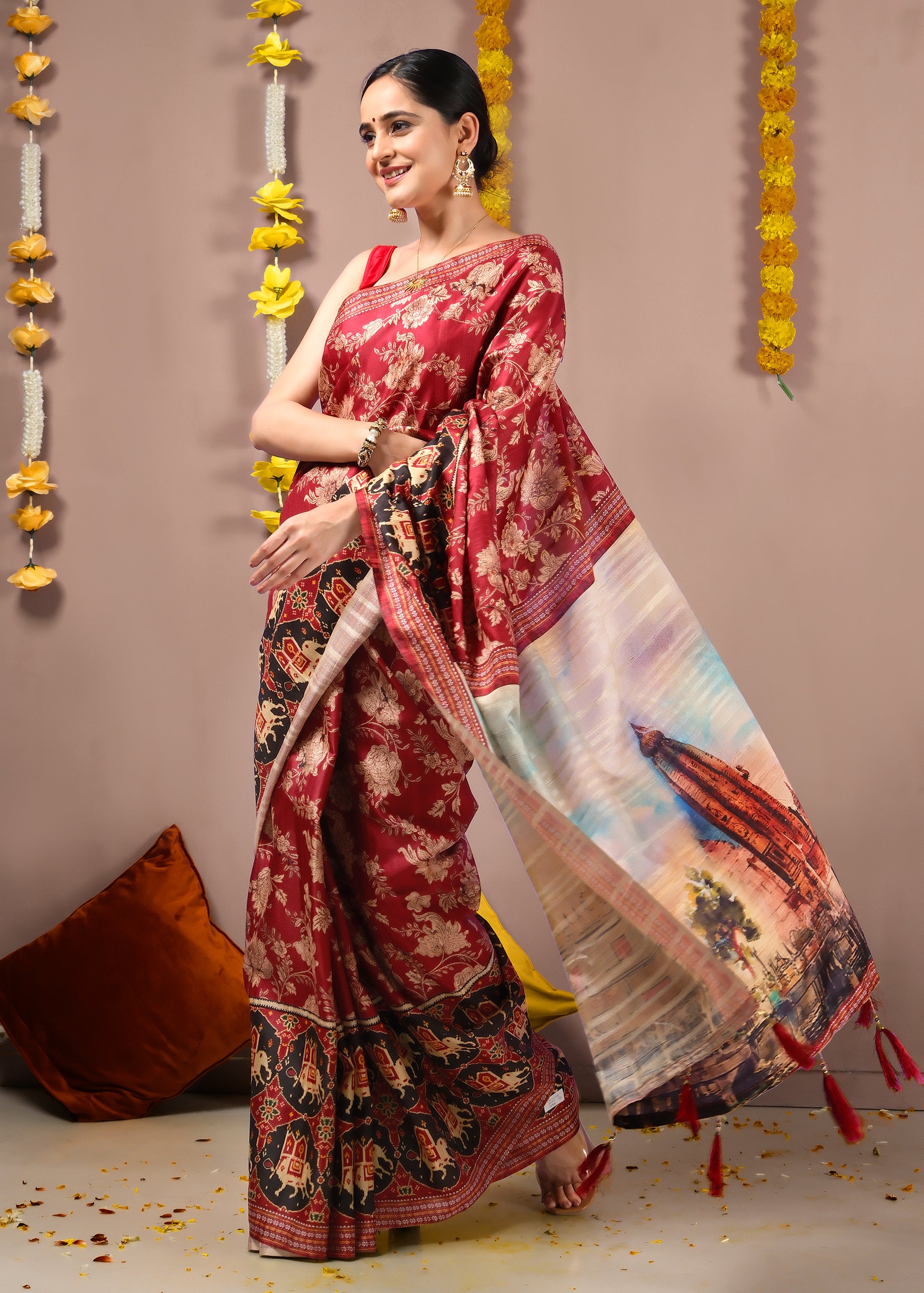 Festive scene with a model dressed in a red saree, featuring temple prints and rich cultural detailing.